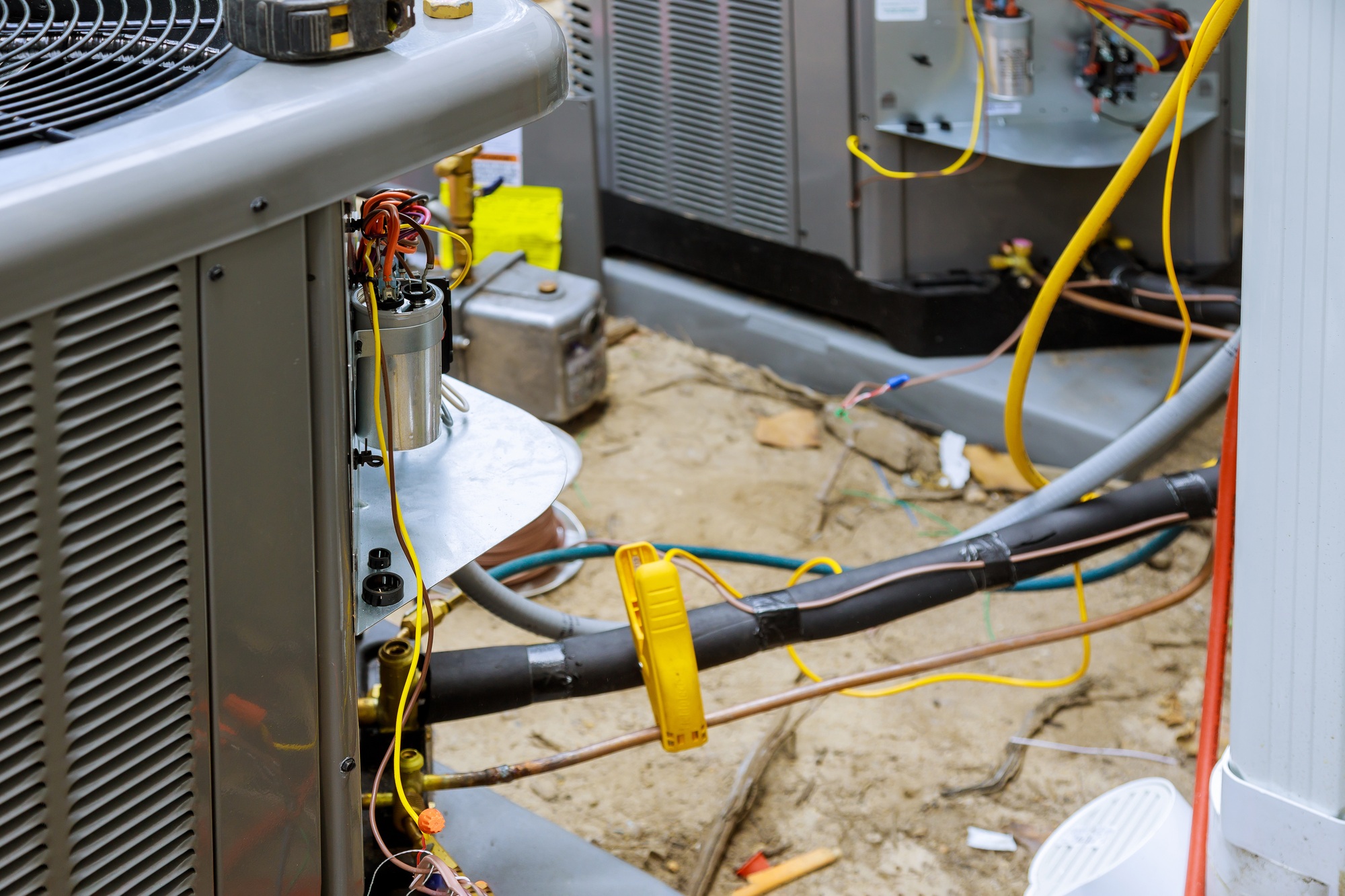 hvac maintenance service technician inspecting AC unit