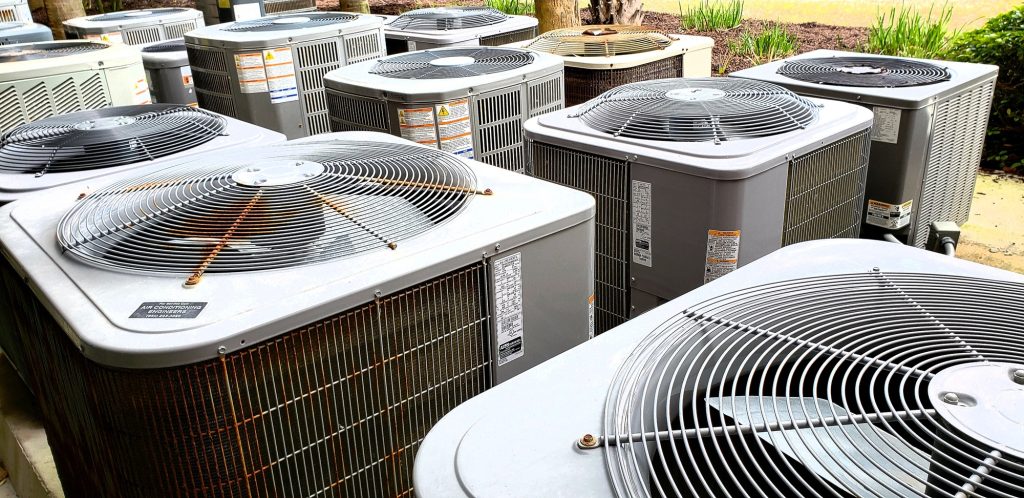 HVAC outdoor appliances at beach condo in grouping dealing with rust issues and shortened life.
